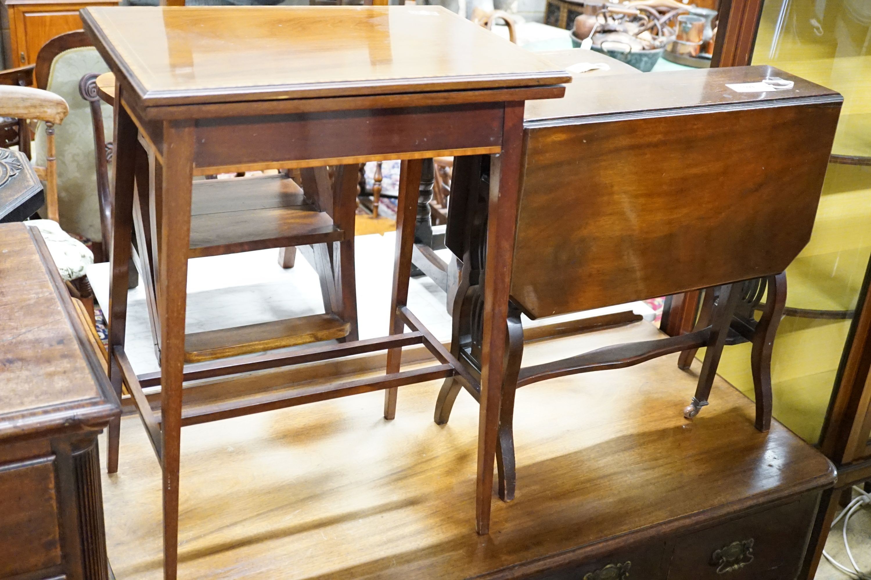 An Edwardian banded mahogany fold-over top table, 51 cm wide, 36 cm deep, 71.5 cm high and a mahogany Sutherland table